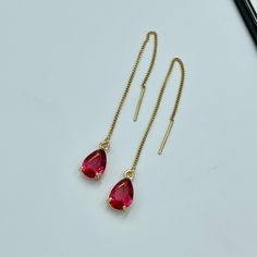 Ruby Pink Thread Teardrop Earrings, Cerise Bright Red Crystal Earrings, Statement Earrings, Long Ruby Earrings Fuchsia Red Thread Earrings. These are simple and beautiful ruby pink teardrop crystal earrings. Bright red crystals are framed in bright gold and dangling from long thread. Measurements: The total length from the top of the hook to bottom - 3.74 inches (95 mm) approximately. Crystals: 10 mm x 6 mm The earrings would be a PERFECT GIFT for you and your family and friends! Click here to s Valentine's Day Teardrop Earrings, Red Statement Earrings, Pink Crystal Earrings, Pink Thread, Emerald Green Earrings, Cerise Pink, Red Thread, Thread Earrings, Ruby Earrings