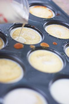 the pans are being prepared to be cooked with some kind of sauce on them