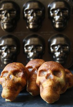 three pastries are sitting next to each other in front of some chocolate molds