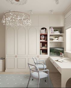 a room with white furniture and a chandelier hanging from the ceiling