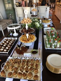 a table filled with lots of food and desserts