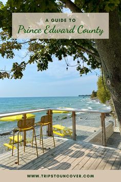 two yellow chairs sitting on top of a wooden deck next to the ocean with text overlay that reads a guide to prince edward county