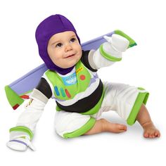 a baby wearing a buzz lightyear costume and holding a skateboard in one hand