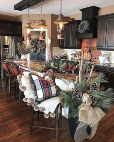 a kitchen decorated for christmas with holiday decorations