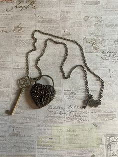 This beautiful bronze locket and key are hanging from a 24inch chain.  It hangs at the perfect length and has a whimsical lock and key toggle that can be worn at the back or side Vintage Brass Necklaces With Two Keys, Metal Key Necklace Perfect As Gift, Vintage Key Necklaces As Gift, Antique Gold Necklaces With Two Keys, Bronze Brass Necklace With Keys, Vintage Metal Jewelry With Two Keys, Necklace Lock, Vintage Lockets, Key Necklace