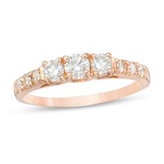 three stone diamond ring in rose gold