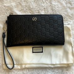 New Authentic Gucci Wristlet. Holds 20 Credit Cards And 2 Spots For Cash And Center Zipper. Measurements: Height 5” Length 9” Depth 1". Trades. Please Send Fair Offers. No Low Balls. Luxury Gucci Clutch, Gucci Chic Evening Clutch, Chic Gucci Clutch For Evening, Luxury Gucci Rectangular Clutch, Elegant Gucci Rectangular Clutch, Designer Gucci Clutch For Evening Events, Gucci Rectangular Clutch For Formal Occasions, Gucci Formal Rectangular Clutch, Elegant Wallet With Wrist Strap In Pouch Shape