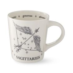 a white cup with an image of a bird on it and the words sagittarius