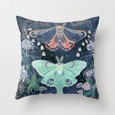 a decorative pillow with an image of a moth on it