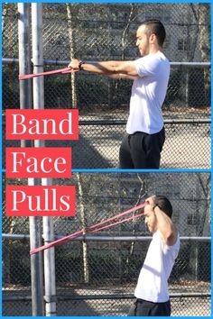 the man is practicing his tennis swing on the court and in front of the fence