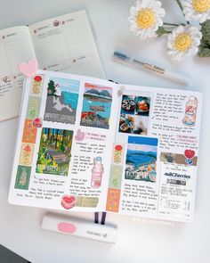 an open planner book with pictures and stickers on it next to flowers, pens and a pen