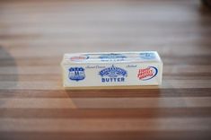 a box of butter sitting on top of a wooden table