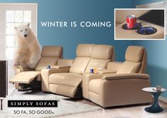 a polar bear sitting on the back of a recliner chair in a living room