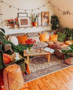 a living room filled with lots of furniture and plants