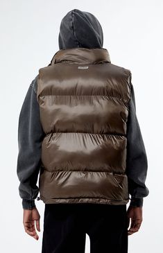 Make a statement with the PacSun Brown Puffer Vest from PacSun, showcasing a stylish standing neckline and sleeveless arms for a versatile look. Its puffer construction, full zip closure, hand pockets, regular fit, and drawcord hem ensure both warmth and a perfect fit in one fashionable package.   	Standing neckline 	Sleeveless 	Hand pockets 	Full zip closure 	Regular fit 	Puffer construction 	Drawcord hem 	Shell: 100% nylon; Lining: 100% nylon; Filling: 100% polyester 	Machine washable 	Model i Puffer Vest Brown, Brown Puffer Vest, Brown Puffer, Puffer Vest, Pacsun, Model Measurements, Puffer, Perfect Fit, Size Medium