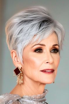 Voluminous Silver Pixie Hairstyle on older woman with cool silver hair. Grey Haircuts For Women, Silver Pixie Cut, Grey Haircuts, Voluminous Layers, Short Grey Haircuts, Silver Pixie, Grey Hairstyles