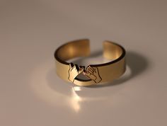 This gold-filled pinky promise ring is an ideal gift to symbolize your strongest bond with a loved one. Its unique cutout design is a modern representation of the traditional pinky swear, a timeless sign of trust, commitment, and friendship. A perfect choice for couples or a meaningful gift for your best friend. Product Details: Materials: 14/20 Gold Filled Color: Gold Size: 6mm You will receive one pinky promise ring. Pinky Promise Rings For Couples, Symbolic Rose Gold Promise Rings, Rose Gold Initial Ring For Promise, Modern Initial Open Ring For Promise, Rose Gold Engraved Promise Ring, Adjustable Rose Gold Engraved Promise Ring, Adjustable Engraved Rose Gold Promise Ring, Meaningful Gold Promise Jewelry, Meaningful Gold Jewelry For Promise