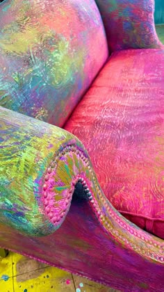 an upholstered couch covered in holographic paint