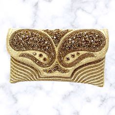 Traditional Beaded Pouch Clutch, Traditional Gold Beaded Clutch, Festive Beige Rectangular Evening Bag, Festive Embellished Beige Clutch, Traditional Beige Embellished Clutch, Beige Rectangular Clutch For Festivals, Traditional Handmade Beige Evening Bag, Traditional Beige Rectangular Clutch, Beige Rectangular Evening Bag With Handwork