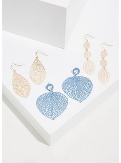 A pack of delicate filigree earrings feature gold-tones and a matte blue option. Style with your hair up to show off and make a statement. Set of 3 . Post back and French hooks. Base metals. Imported. The best plus size women's matte blue filigree dangle earrings set - of 3 sets in blush. Torrid is your destination for the freshest spring and summer styles. Hot Pink Floral, Wire Flowers, Filigree Necklaces, Floral Hoops, Fan Earrings, Green Polka Dot, Filigree Earrings, Faux Stone, Stud Earrings Set