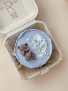 there is a small cake in the shape of a bear