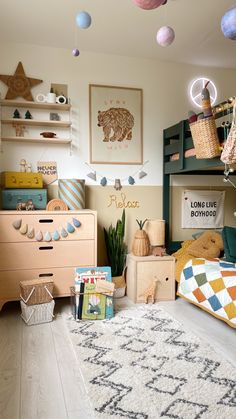 a child's bedroom with lots of toys on the floor and shelves above it