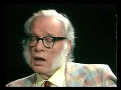 an old man wearing glasses and a plaid suit is talking to someone on the television