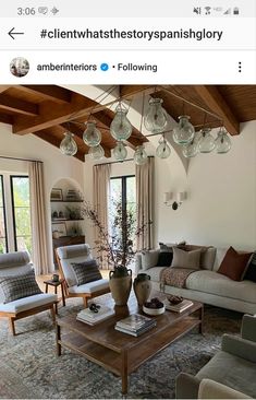 a living room filled with lots of furniture and decor on top of a wooden table