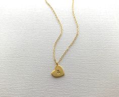 A beautiful heart necklace hand-stamped with your choice of letter initials. This multiple heart initial necklace is perfect for moms, mothers, grandma, grandmothers, girlfriends, wife, wives etc. Carry your loved ones with you wherever you go! Matte Gold 10mm gold-plated hearts, hand stamped with your choice of uppercase or lowercase letters. Choose between a gold plated or 14k gold filled chain. DETAILS: - 10mm heart stamped with UPPERCASE or lowercase initials - Matte Gold finish - Hand-stamp Personalized Heart Pendant Charm Necklace For Everyday, Personalized Double Heart Necklace For Everyday, Dainty Initial Necklace For Mother's Day Anniversary, Dainty Hand Stamped Heart Necklaces, Everyday Initial Heart Pendant Necklace For Mother's Day, Heart-shaped Initials Charm Necklace For Anniversary, Everyday Heart Initial Pendant Necklace For Mother's Day, Personalized Heart Pendant Initial Necklace For Everyday, Heart-shaped Initial Necklace For Anniversary Gift