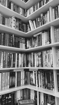 a bookshelf filled with lots of different kinds of books on top of each other