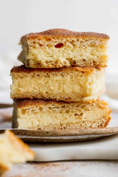 three pieces of cake sitting on top of a plate