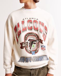 Elevate your game day ensemble with the Men's Atlanta Falcons Graphic Crew Sweatshirt from Abercrombie & Fitch. This piece combines comfort and style, making it a must-have for any Falcons fan.

- Size: XS
- Color: Cream
- Material: Cotton, Polyester
- Gender: Male
- Features: Crew neckline, banded hem and cuffs, Atlanta Falcons graphic on chest

Crafted in our signature softAF fleece fabric, this sweatshirt offers an oversized fit that ensures ease of movement and ultimate comfort. Whether you' Off White Sweatshirt, Colorful Sweatshirt, Men's Tops, Tennessee Titans, Atlanta Falcons, Philadelphia Eagles, Crew Sweatshirts, White Sweatshirt, Hoodie Top