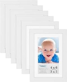 a set of six white frames with a baby's face