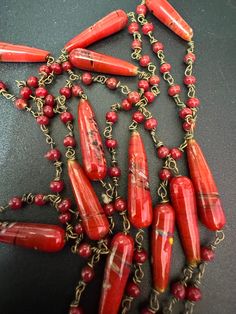 Vintage red glass ceramic beaded gilt metal chain link long end of day bead necklace 110cm Red Double Strand Beaded Chain Jewelry, Red Beaded Double Strand Jewelry, Vintage Red Jewelry With Dangling Beads, Red Double Strand Beaded Jewelry, Red Multi-strand Dangling Beads, Red Multi-strand Beaded Chain Necklace, Red Multi-strand Beaded Chain Necklaces, Red Glass Bohemian Necklace, Red Beaded Chain Costume Necklace