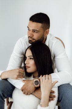 a man and woman sitting on top of each other