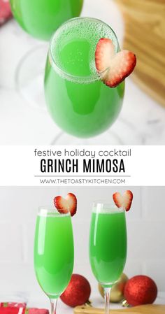 two glasses filled with green drinks and strawberries on the rim, next to each other