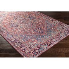 an antique persian rug on a wooden floor