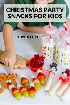 a young boy is making christmas party snacks for his kids to eat and play with