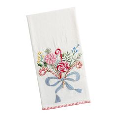 a white towel with flowers on it