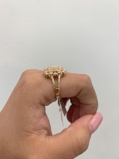 Virgin mary ring in 14k gold, 3 tone, white, rose and yellow gold, it has details of cubic zricinias around the image of the virgin, and a design of flowers and hearts, the flowers are in rose gold color, it is a ring very detailed, made in italy, size 7 but we can make it to the measure you need, if you have a question send a message, item sold by piece, weight undetermined. Rose Gold Multi-stone Cubic Zirconia Ring, Gold Cubic Zirconia Flower Ring With Halo Setting, Gold Diamond Flower Ring With Halo Setting, Heirloom Rose Gold Diamond Flower Ring, Fine Jewelry Rose Gold Flower Ring With Halo Setting, Rose Gold Flower Ring With Halo Setting, Fine Jewelry Gold Flower Ring With Halo Setting, Gold Flower Ring With Halo Setting In Fine Jewelry, Gold Flower Ring With Halo Setting