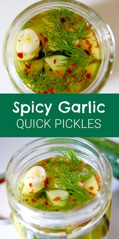 two jars filled with pickles on top of a table