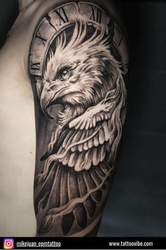 an eagle tattoo on the back of a man's arm, with roman numerals