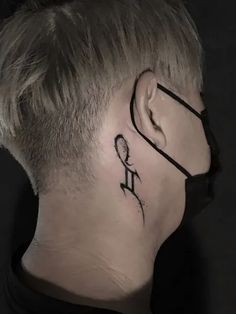 a man with a tattoo on his neck