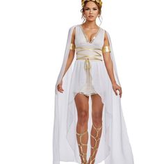 a woman in a white costume with gold accents on her head and legs, standing