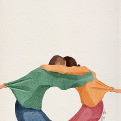 two people hugging each other with their arms wrapped around them