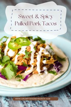 sweet and spicy pulled pork tacos on a plate