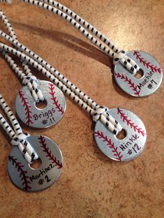 three baseball lanyards with personalized tags on them