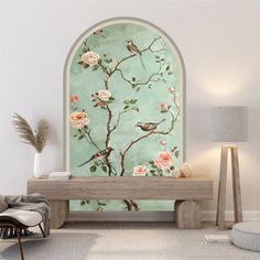 a room with a bench and flowers on the wall