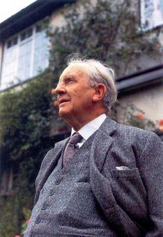 an older man wearing a suit and tie in front of a house with the words'charles allen'written on it