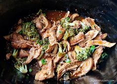 broccoli and chicken stir fry in a wok